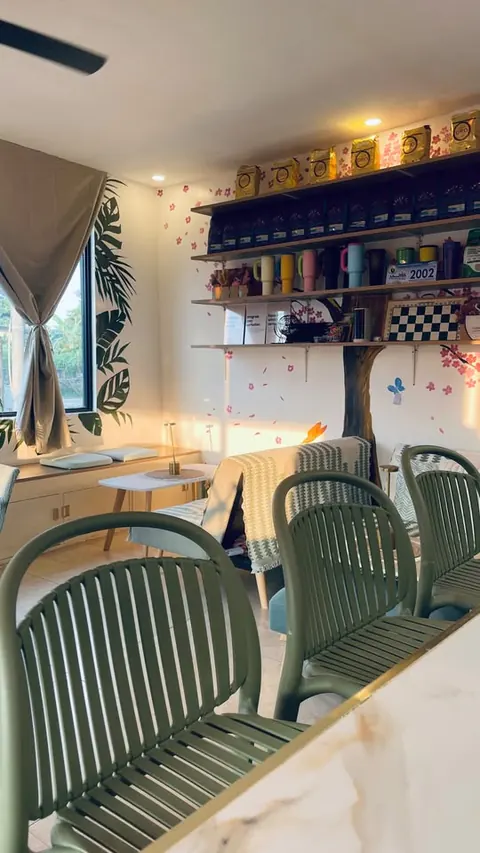 Green slatted bar stools at the counter, looking toward the lounge