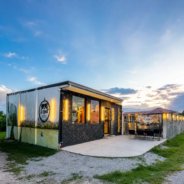 The A’venue Café container building at dusk
